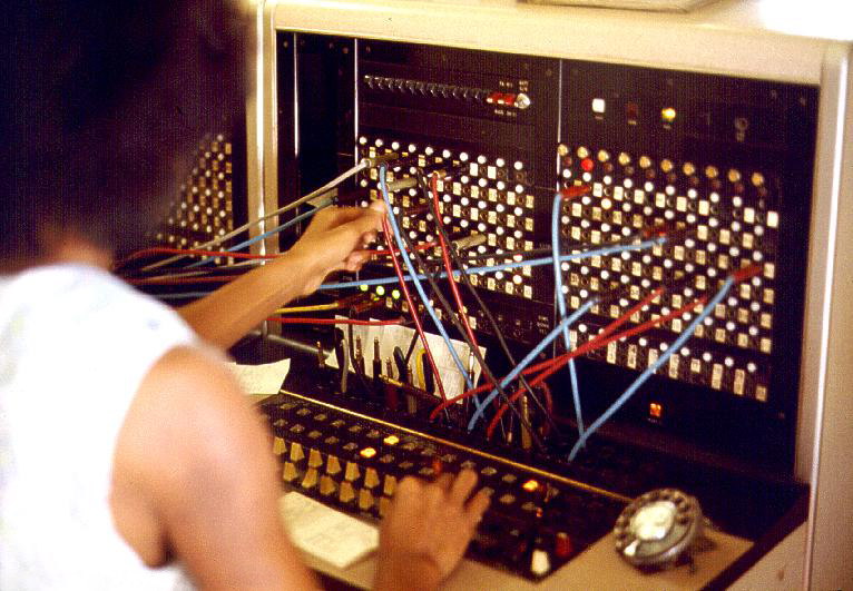 Image author: Joseph A. Carr https://commons.wikimedia.org/wiki/File:Jersey_Telecom_switchboard_and_operator.jpg